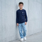 Polo manga larga azul ANG Kidz niño – look urbano con jean baggy gris